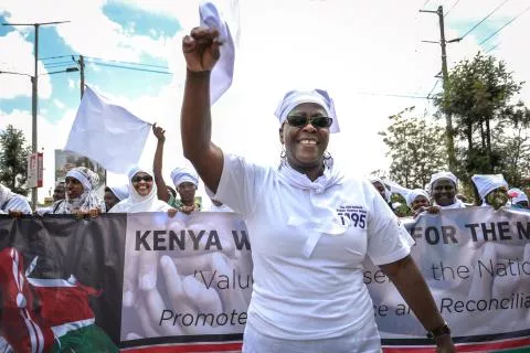 On October 24, 2017, Fanis Lisiagali, Executive Director of Healthcare Assistance Kenya, leads the White Ribbon Campaign march and promotes their rapid response call center hotline which responds to violence against women in elections in Nairobi, Kenya, as part of IFES’s Kenya Electoral Assistance Program.     Photo Credit: Carla Chianese, IFES