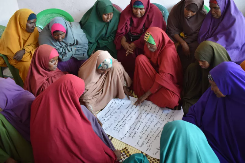 Somali women living in El Waq, a small town in Somalia have long suffered years of conflict, marginalization and drought. USAID, through Somalis Harmonizing Inter-and-Intra Communal Relationships program, brought these women together from conflicting clans to learn, decide and plan the future of their district in November 2017.     Photo Credit: Mohamed Abdullah Adan, PACT