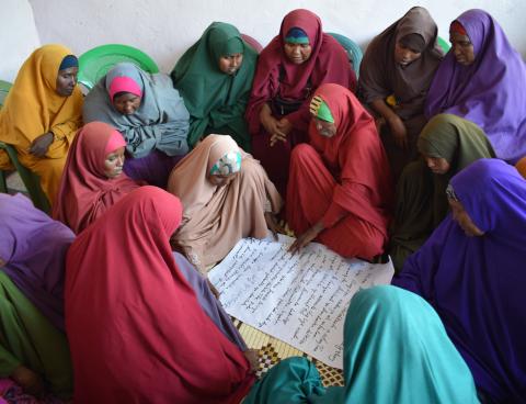 Somali women living in El Waq, a small town in Somalia have long suffered years of conflict, marginalization and drought. USAID, through Somalis Harmonizing Inter-and-Intra Communal Relationships program, brought these women together from conflicting clans to learn, decide and plan the future of their district in November 2017.     Photo Credit: Mohamed Abdullah Adan, PACT